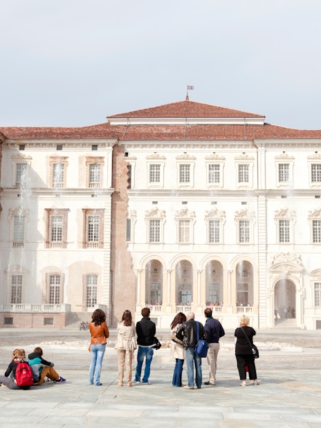 Tourists viewing fountains at Palace of Venaria Reale, a royal residence near Turin, Piedmont.