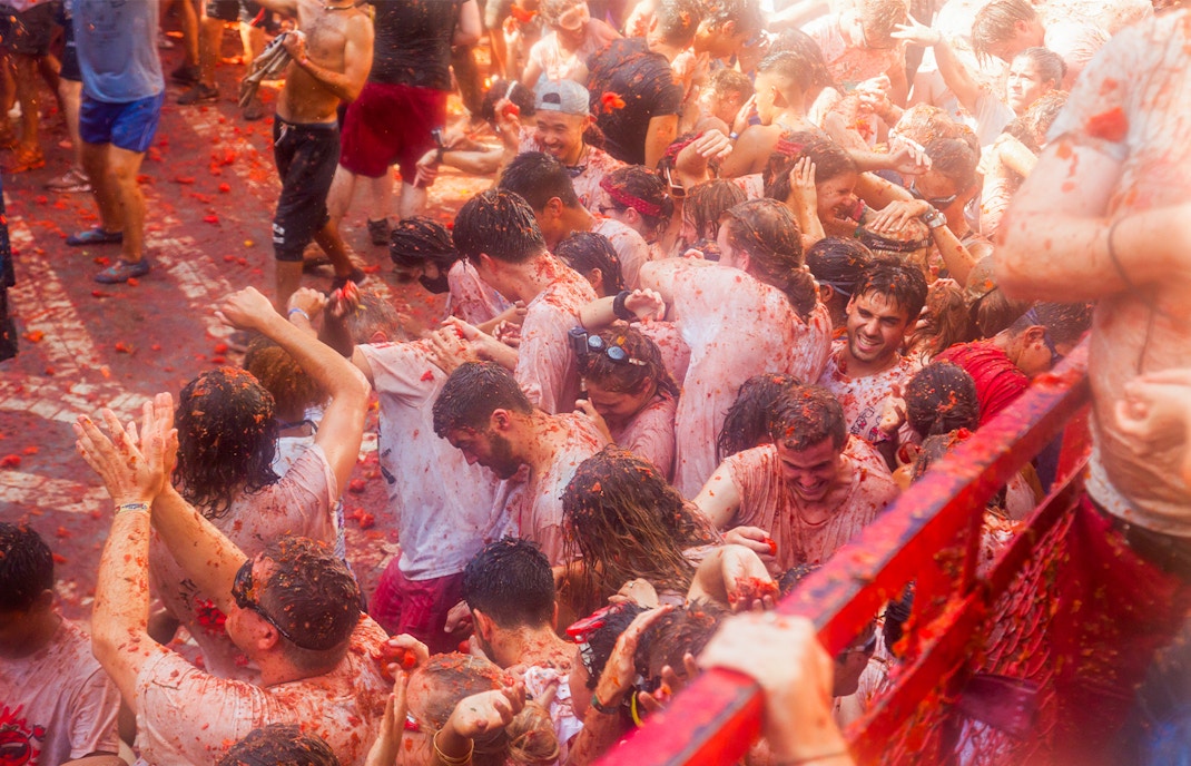 Crowd enjoying tomato fight at La Tomatina festival in Buñol, Spain.