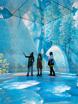 Visitors exploring immersive art installation at Frameless London.