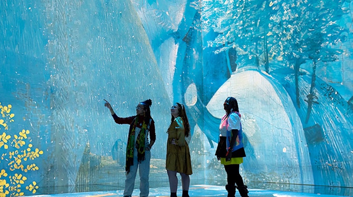 Visitors exploring immersive art installation at Frameless London.