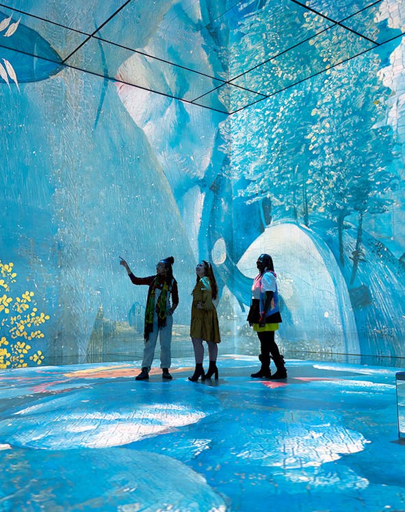 Visitors exploring immersive art installation at Frameless London.