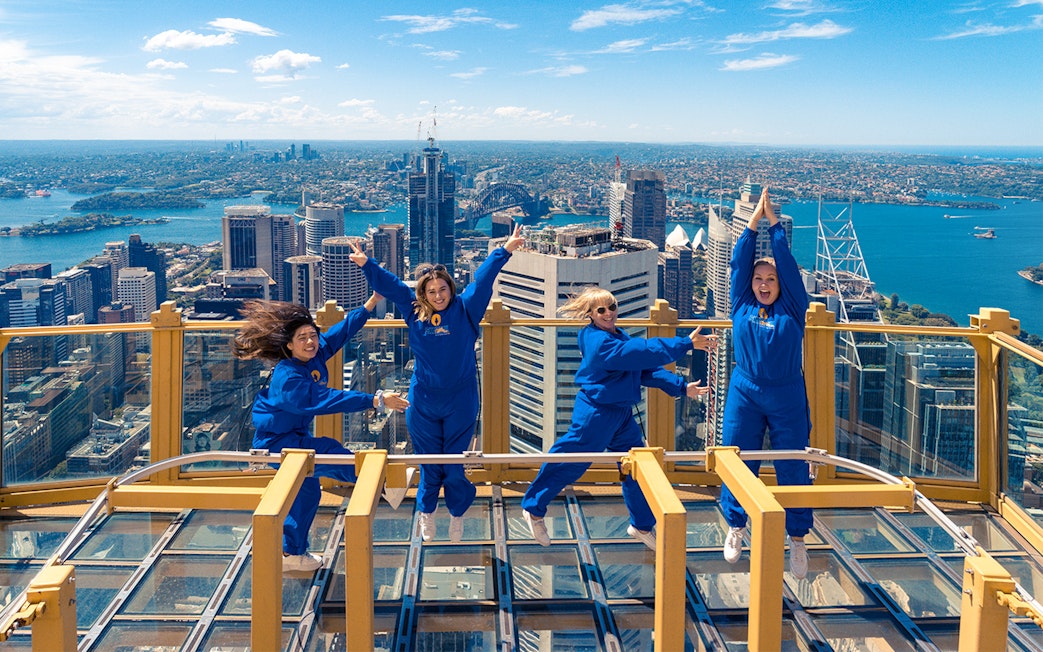 Visitors enjoying the view from Sydney Tower Eye's outdoor platform.