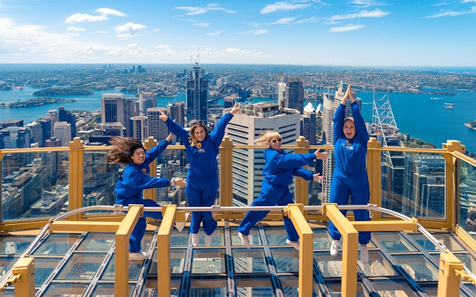 Visitors enjoying the view from Sydney Tower Eye's outdoor platform.
