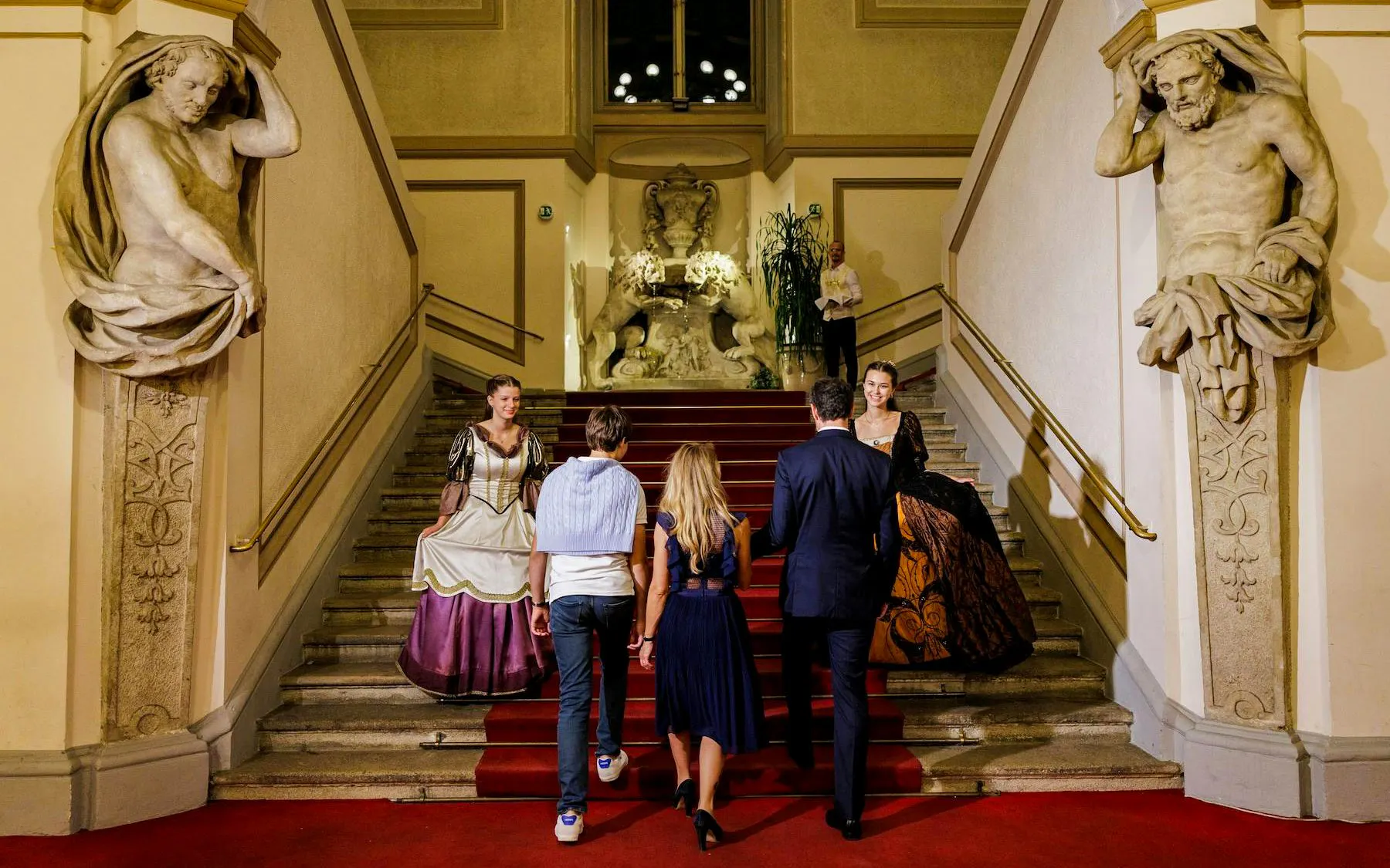 Guests ascending stairs at Palais Auersperg for Imperial Gala Concert, Vienna.