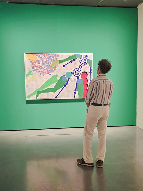 Visitors viewing modern art at Centre Pompidou Malaga exhibition interior.