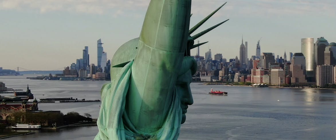 Gondola gliding through Venice City canal with historic buildings in view.