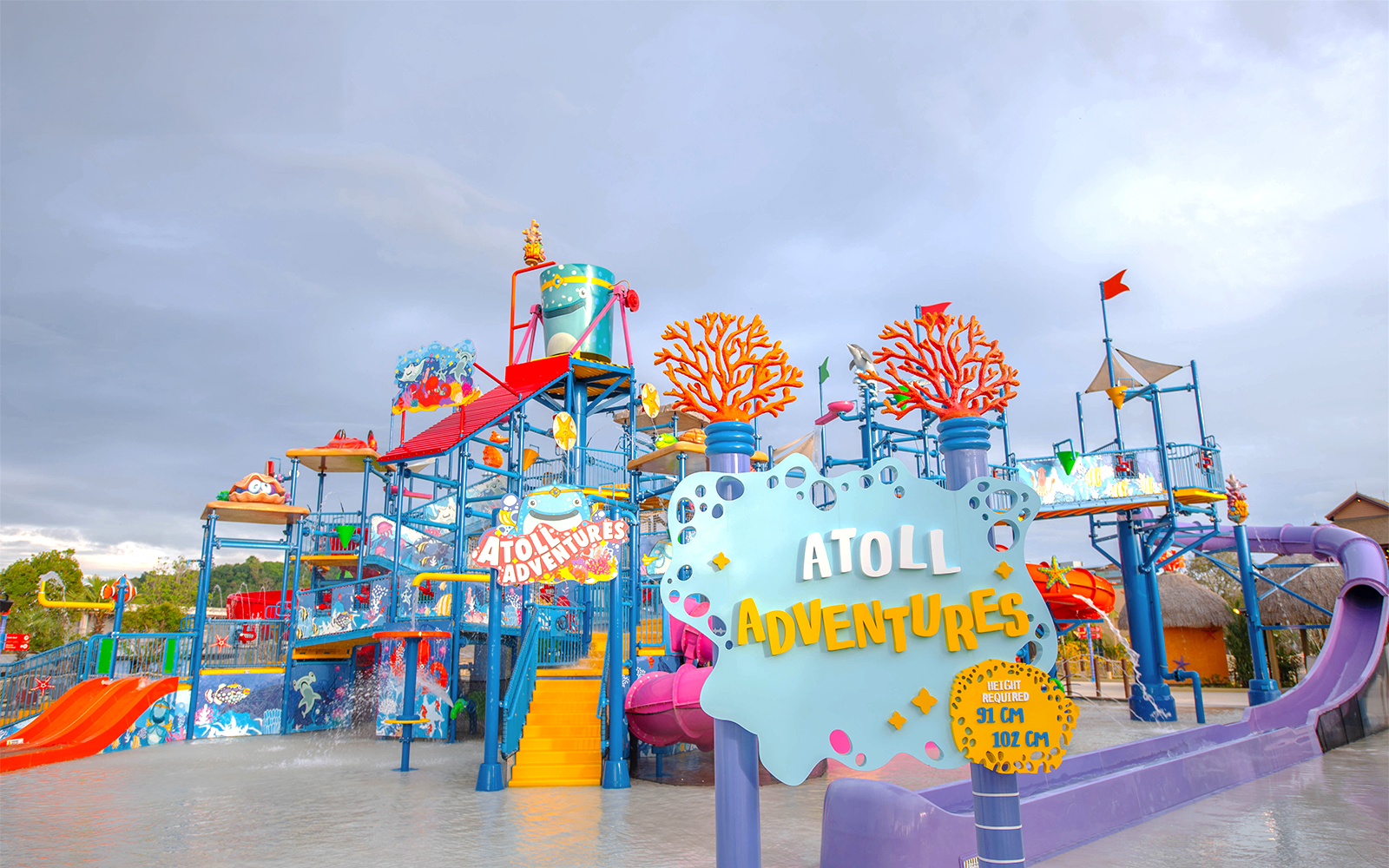 Water park attractions at Andamanda Phuket Atoll Adventures, featuring slides and pools in Phuket, Thailand.