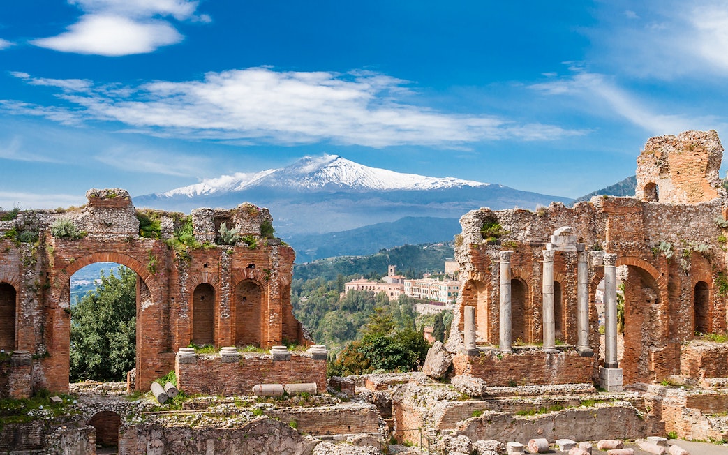 Ancient Theater of Taormina with Mount Etna in the background, Sicily.