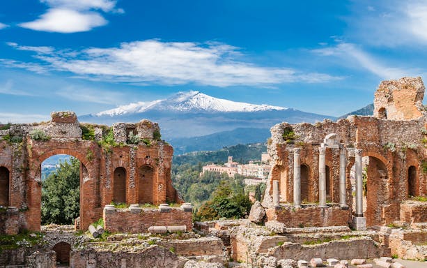 Ancient Theater of Taormina with Mount Etna in the background, Sicily.