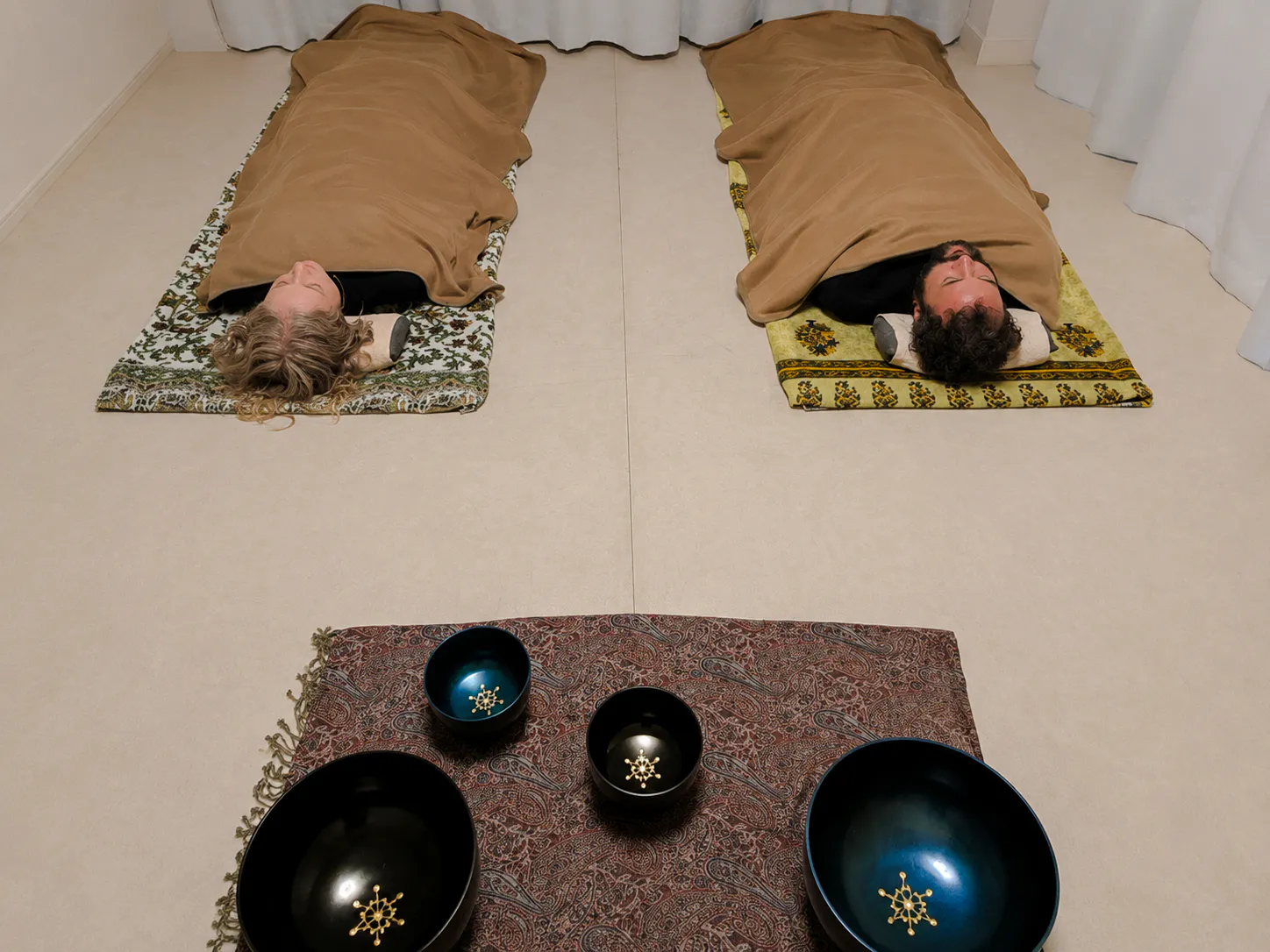 Participants in lying-down meditation during a private Japanese sound bath in Kyoto.