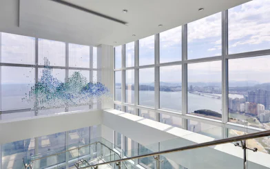 Observation deck view from BUSAN X The SKY with cityscape and ocean.