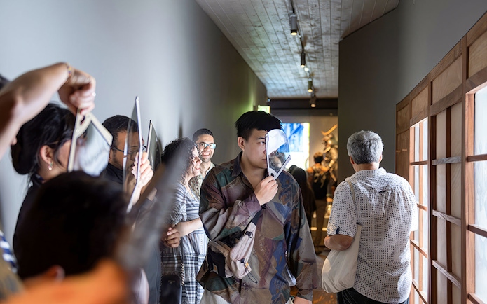 Visitors exploring exhibits at the Samurai Museum, engaging with interactive displays.