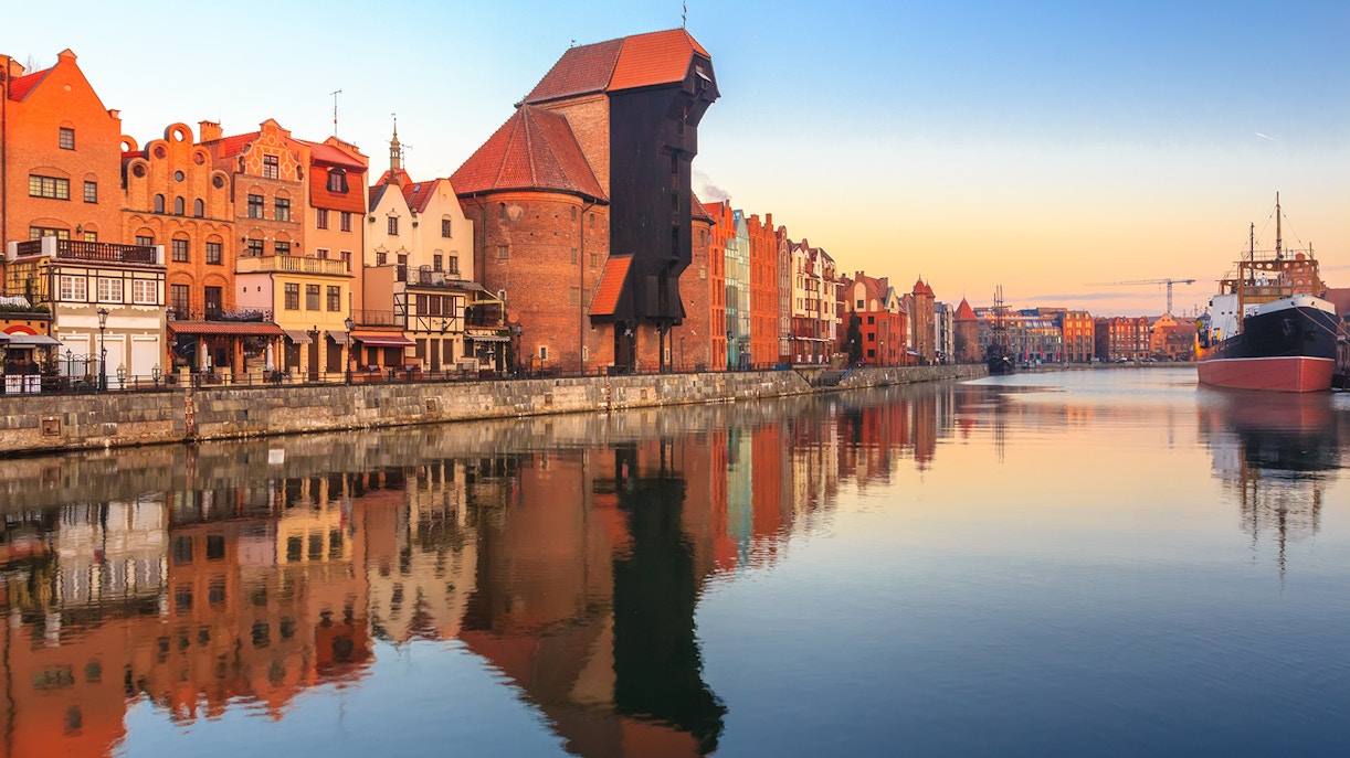Gdansk waterfront with historic buildings and pirate ship for lunch cruise to Westerplatte.