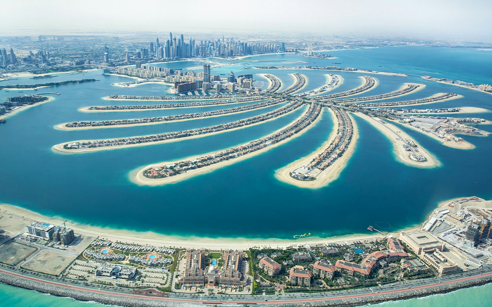 Aerial view of Palm Jumeirah and Dubai skyline during a private helicopter tour.