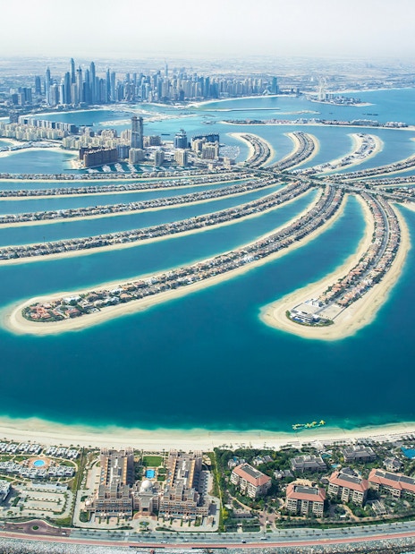 Aerial view of Palm Jumeirah and Dubai skyline during a private helicopter tour.