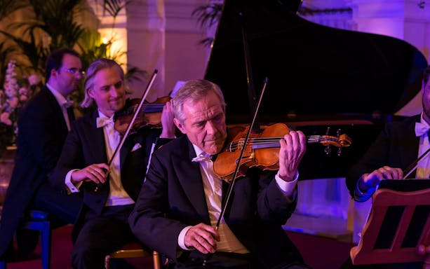 Violinists performing at Mozart and Strauss concert in Kursalon Vienna.