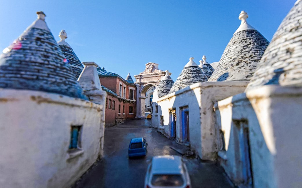 Miniature trulli houses and archway at Italia in Miniatura, Italy.