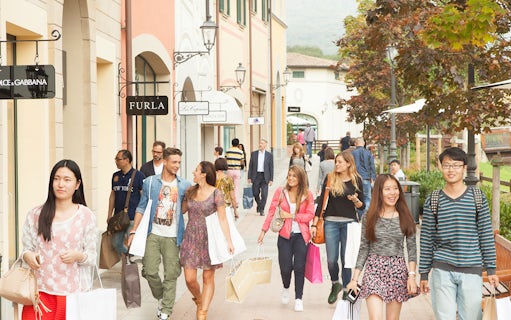 Shoppers walking at Barberino Designer Outlet near Florence.