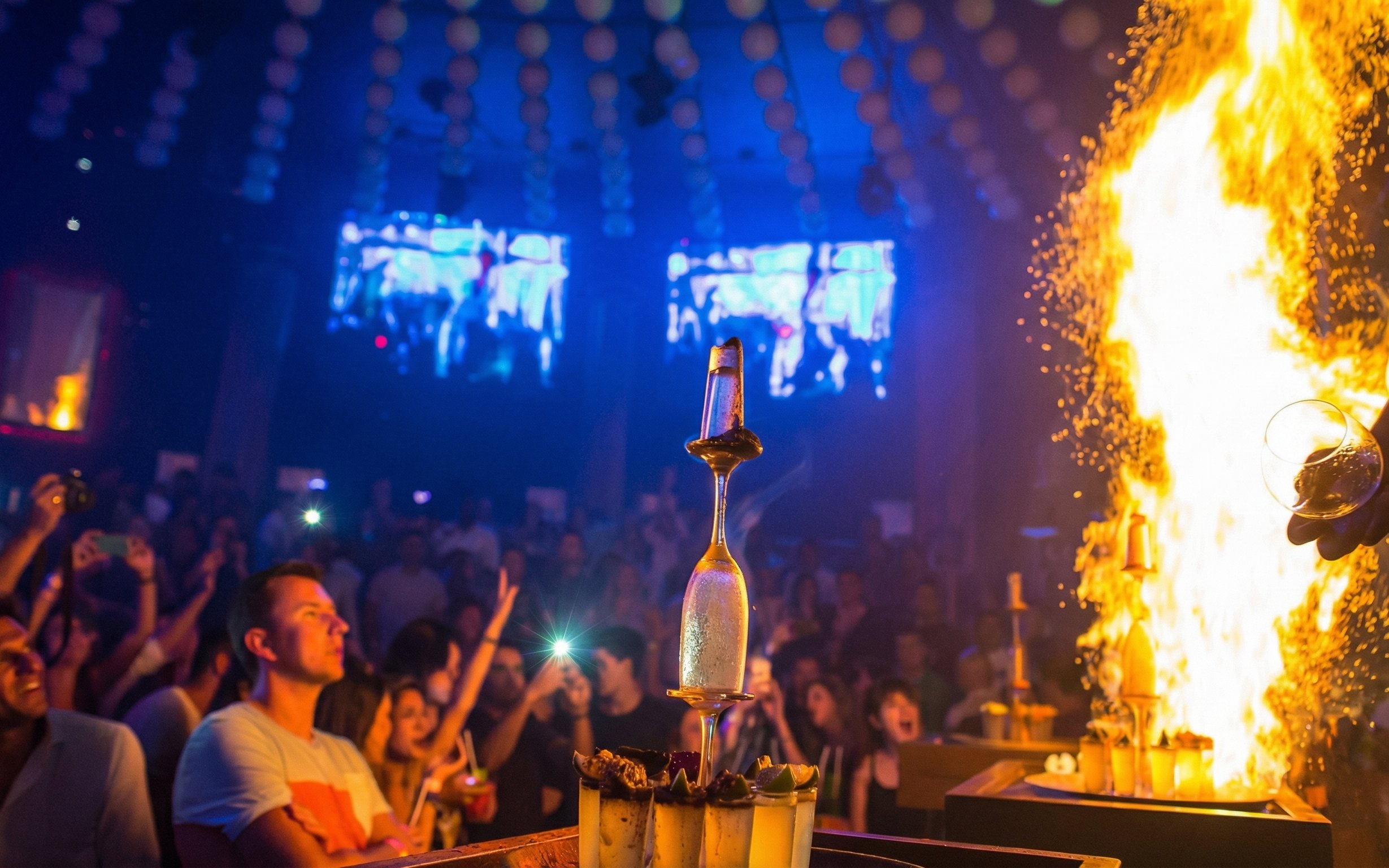 Crowd enjoying a fire show at Mandala Nightclub in Cancun.