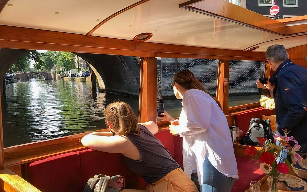 Guests enjoying canal views on the Rotterdam Boat Sightseeing Tour.