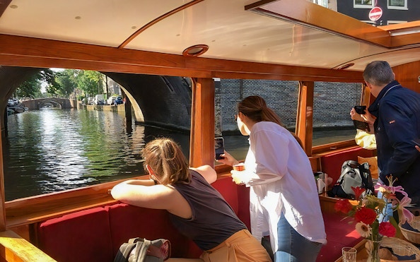 Guests enjoying canal views on the Rotterdam Boat Sightseeing Tour.