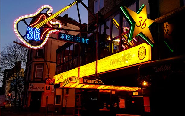 Neon signs at Grosse Freiheit 36 in Hamburg's Kiez district at night.