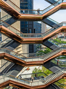 Vessel structure in New York with people walking on interconnected staircases.