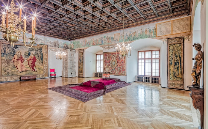 Wawel Castle 2nd floor room with tapestries and chandeliers, Krakow, Poland.