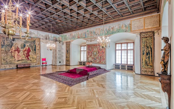 Wawel Castle 2nd floor room with tapestries and chandeliers, Krakow, Poland.
