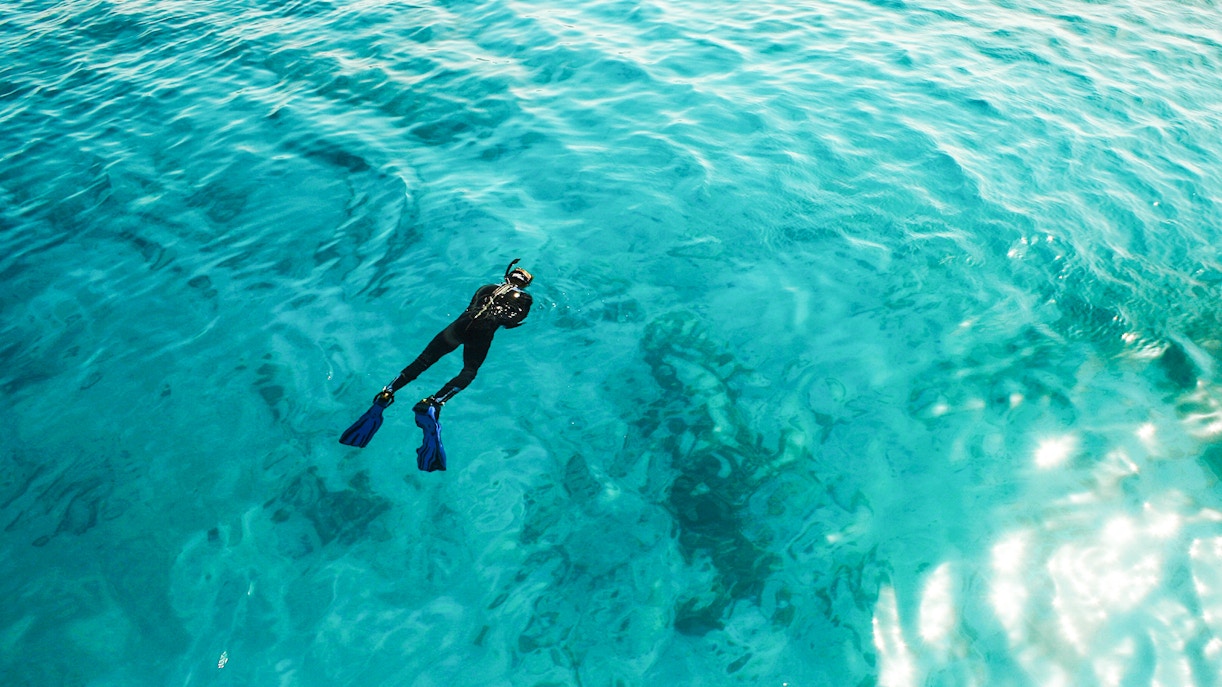 Snorkeler in clear waters at White Island, Ras Mohamed National Park, Sharm El-Sheikh.