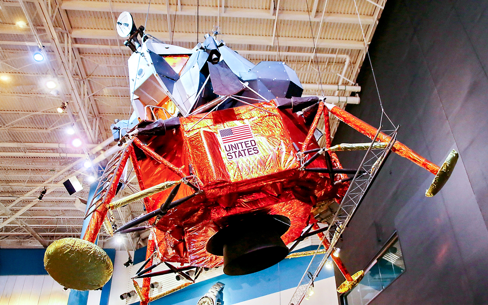 Lunar Module LTA-8 exhibit at Houston Space Center with detailed interior view.