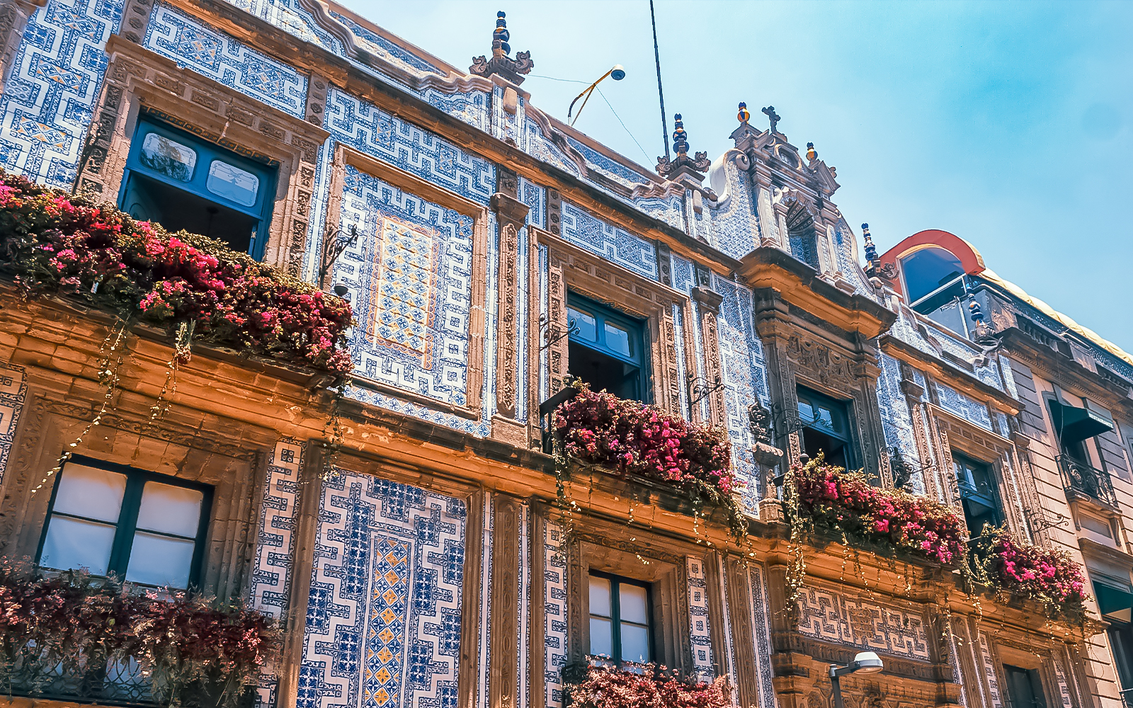Casa de los Azulejos facade with intricate blue and white tilework in Mexico City.