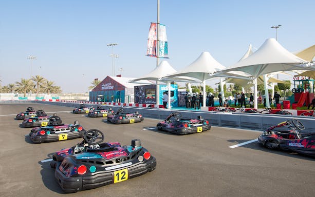 Go-karts lined up at YAS Marina Circuit Kartzone track in Abu Dhabi.