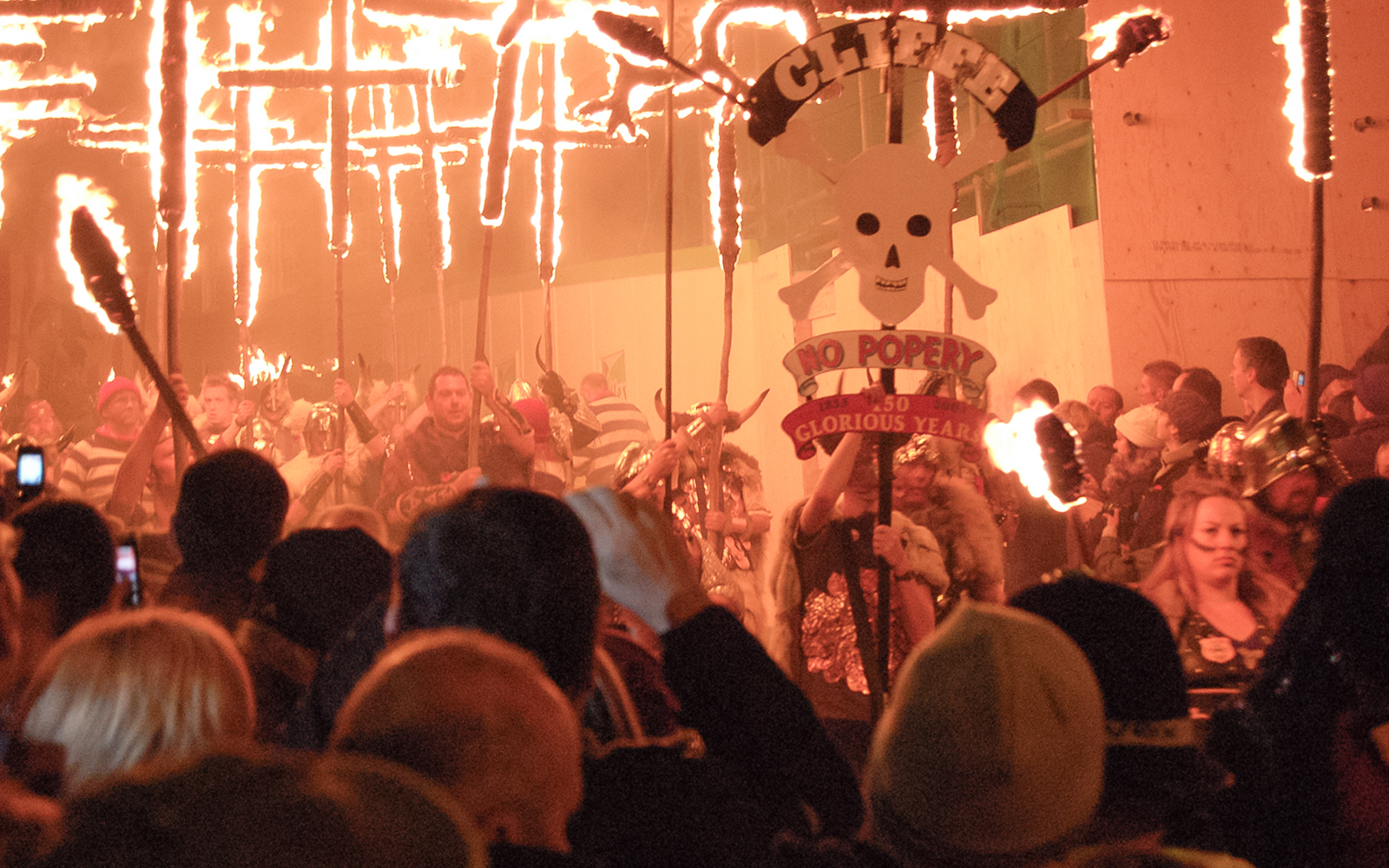 Lewes Bonfire Night parade with flaming torches and fireworks, Guy Fawkes Night celebration, UK.