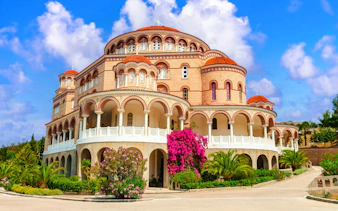 Monastery of Agios Nektarios with arches and domes on Aegina Island, Greece.