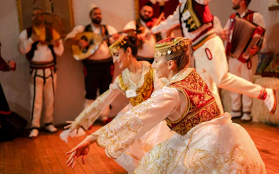 Artists performing traditional dance during Albanian Night Cultural Dance & Music Experience.