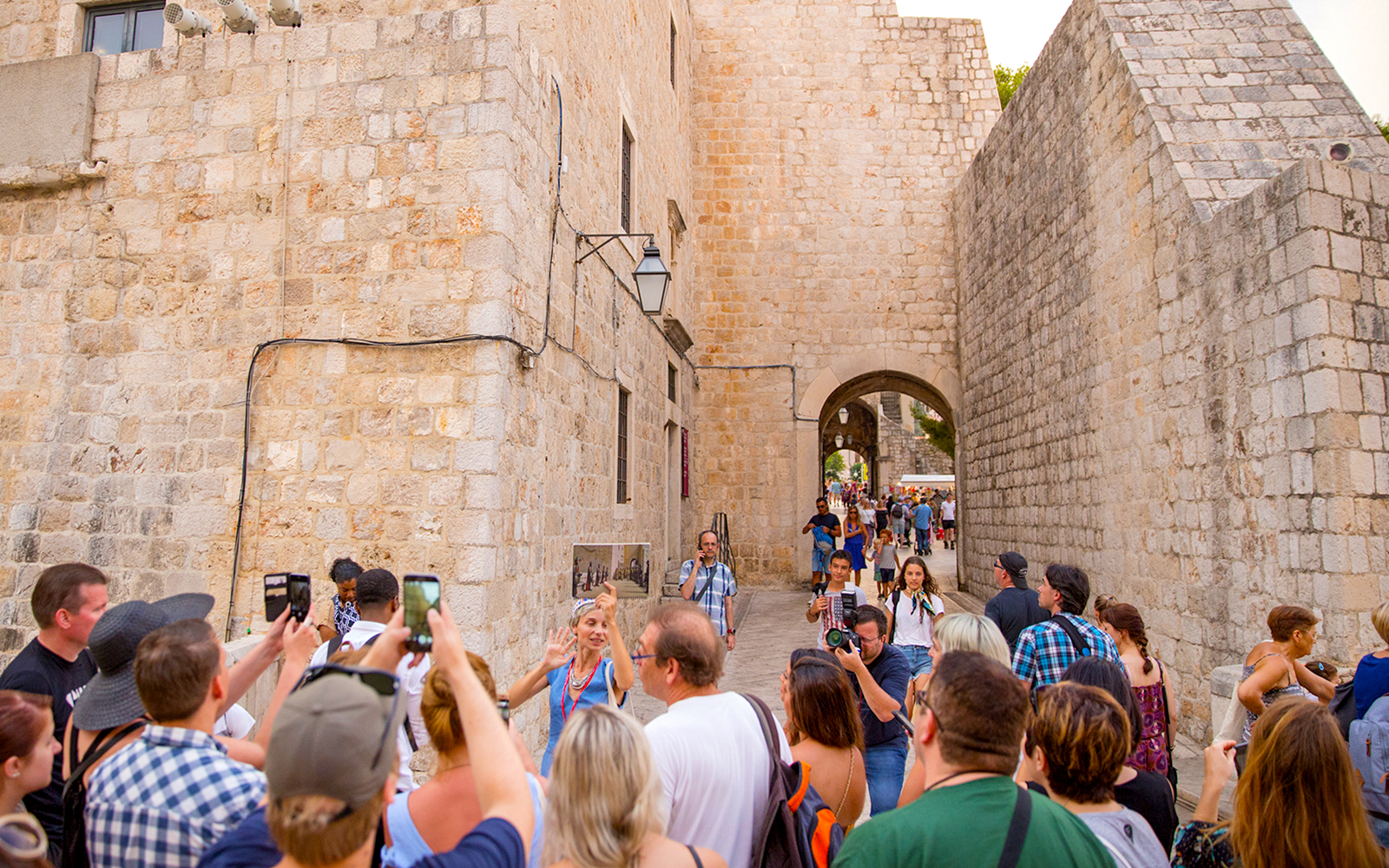 Guests exploring historic stone walls at Elaphiti Islands.