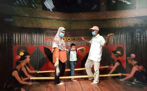 Family participating in a cultural dance activity in Dubai.