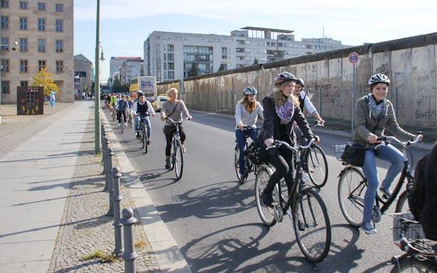 Bike tour going by the Berlin wall