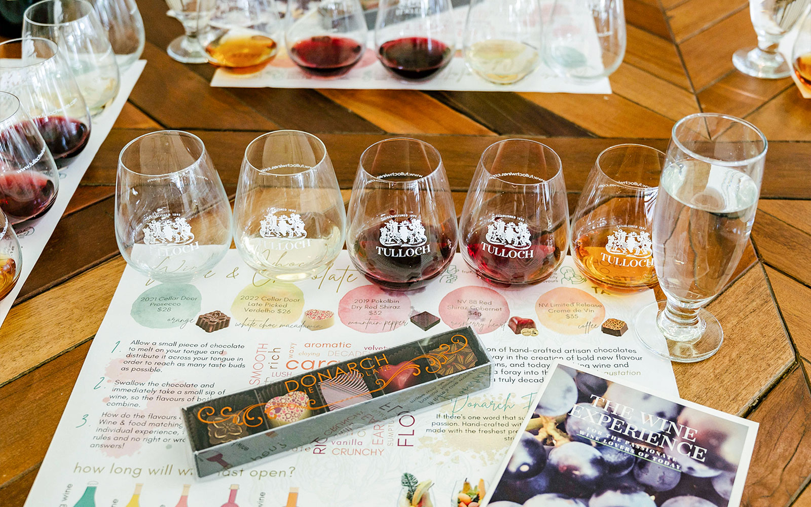 Tulloch Wines tasting set with various wine glasses and a local cheese board menu.