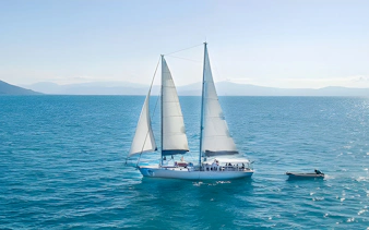 Sailing boat on the ocean during Cairns to Great Barrier Reef and Green Island cruise.