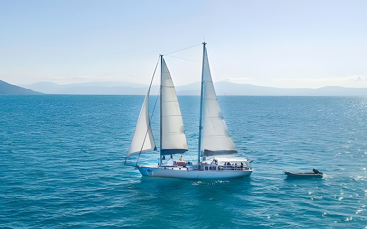 Sailing boat on the ocean during Cairns to Great Barrier Reef and Green Island cruise.