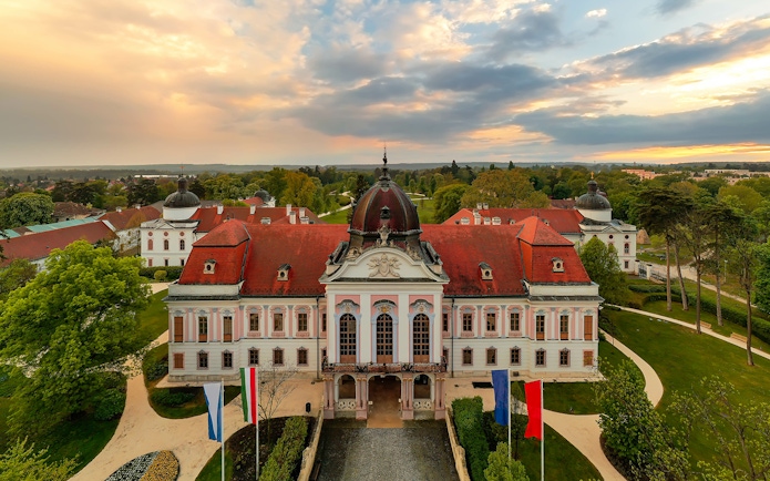 Gödöllő Royal Palace with red roof and gardens, Budapest tour.