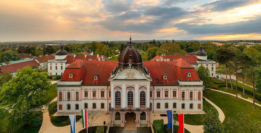 Gödöllő Royal Palace with red roof and gardens, Budapest tour.