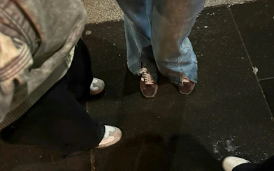 Participants gather on a Glasgow street for a ghost hunt city exploration game.