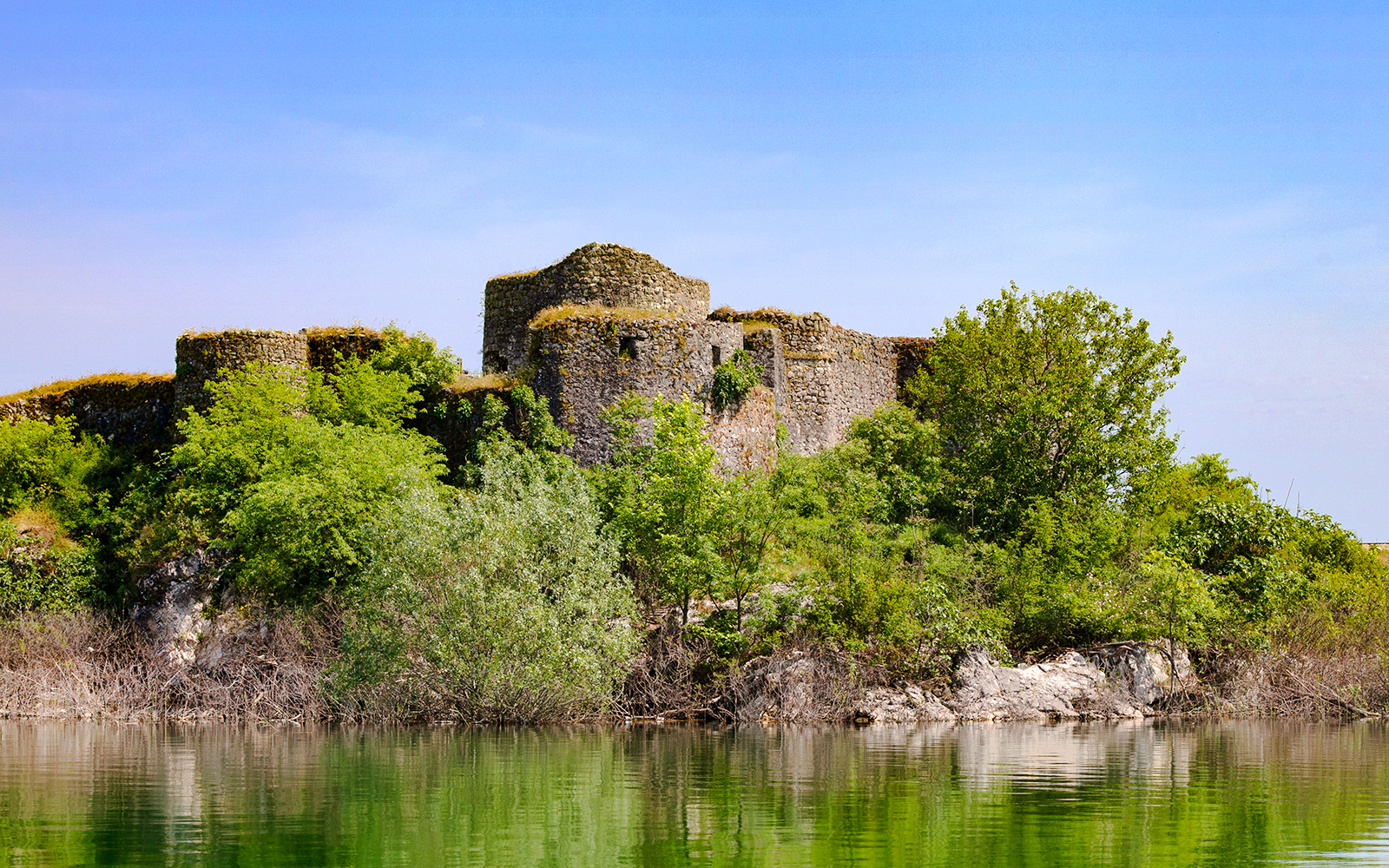 Ruins of a fortress surrounded by greenery at Skadar Lake, Montenegro.