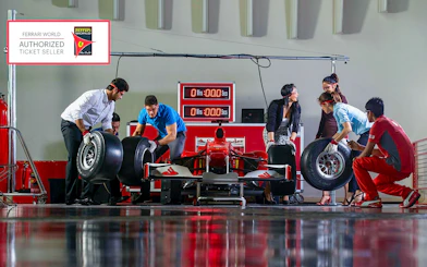 Team changing tires on a Formula 1 car at Ferrari World, Yas Island.
