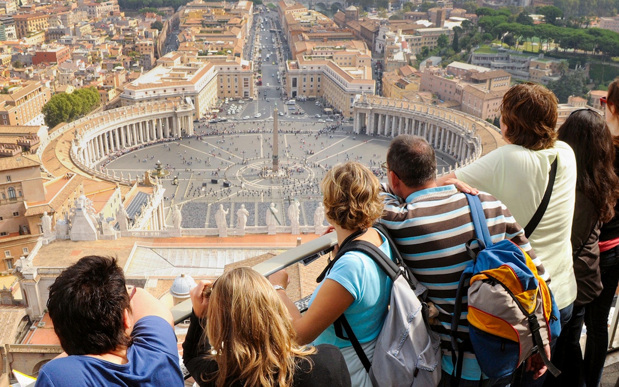 Tourists viewing St. Peter's Square from the dome of Saint Peter's Basilica, Vatican City.