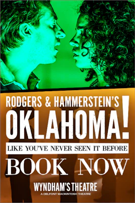 Cast of Oklahoma! performing on stage with vibrant costumes and set design.