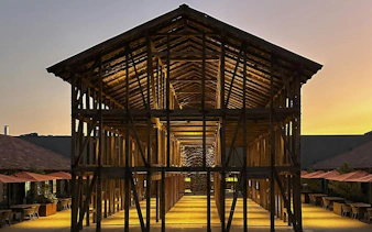 Wooden structure at Viña Concha y Toro wine center during sunset in Santiago, Chile.